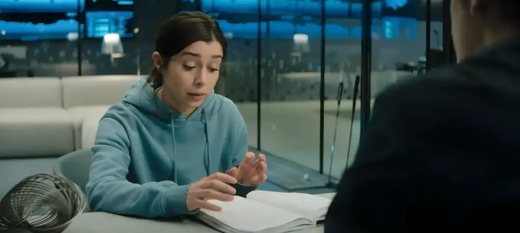 Nanette revela sua descoberta sobre o código de clonagem escondido, durante conversa com Walton.