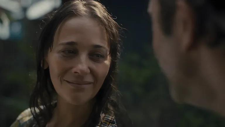 Amanda smiles at Mike in one of the final scenes of 'Common People', Black Mirror, symbolizing a farewell moment.