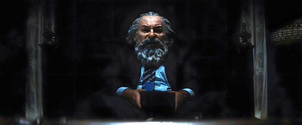 Dylan wears Kier's mask while participating in the ritual at the founder's bed.