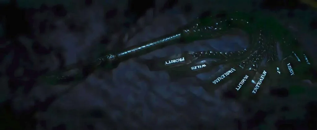 Scene from the series Severance shows Dylan holding a ceremonial nine-tailed whip during the Waffle Party. Each tail represents one of Kier's Nine Core Principles, symbolizing domination over the four humors.