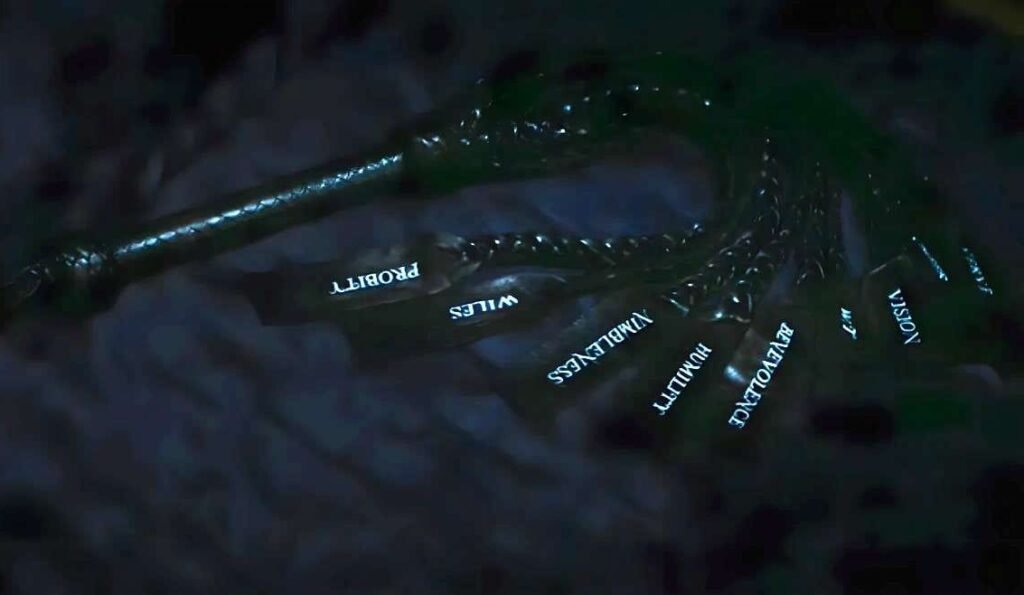 Scene from the series Severance shows Dylan holding a ceremonial nine-tailed whip during the Waffle Party. Each tail represents one of Kier's Nine Core Principles, symbolizing domination over the four humors.