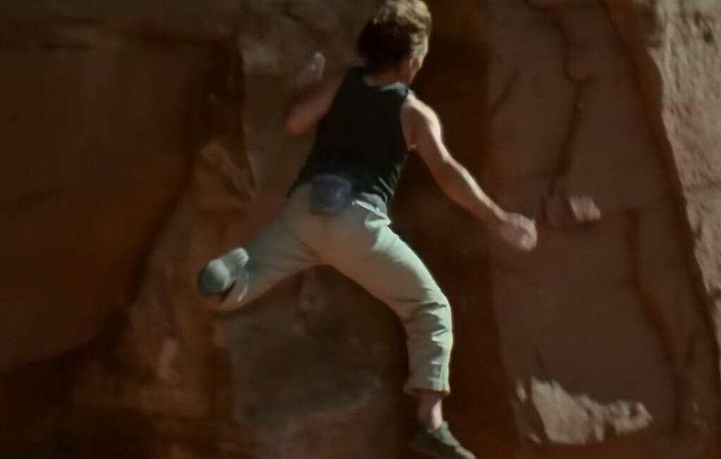 Tom Cruise free climbing a real cliff in Utah during the opening of Mission: Impossible 2 (2000), without visible ropes.