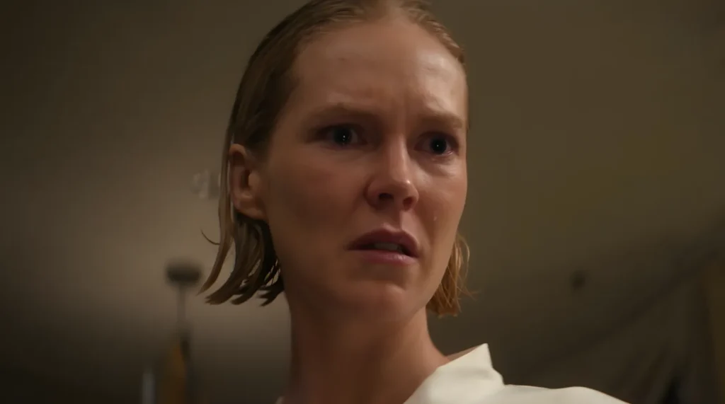 Verity stares at Maria with a cold expression, moments before explaining why she chose her as a target in Black Mirror's Bête Noire episode.