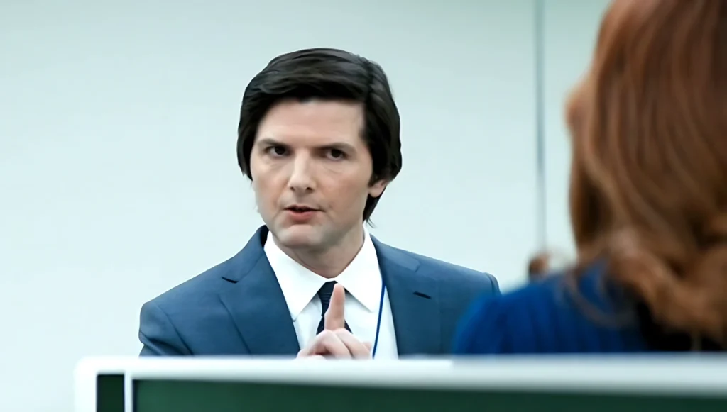Image from episode 1x04 of Severance with Mark pointing his finger and stating that the work is mysterious and important, reflecting the senseless corporate doctrine imposed on employees.