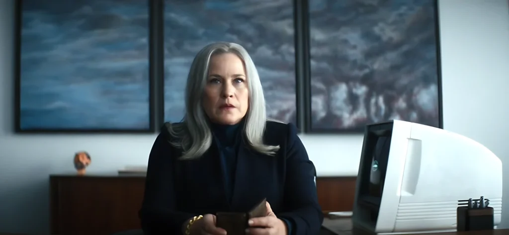 Scene from episode 1x04 of Severance where Ms. Cobel delivers Lumon's nine principles in a near-religious tone, illustrating corporate culture as cult.