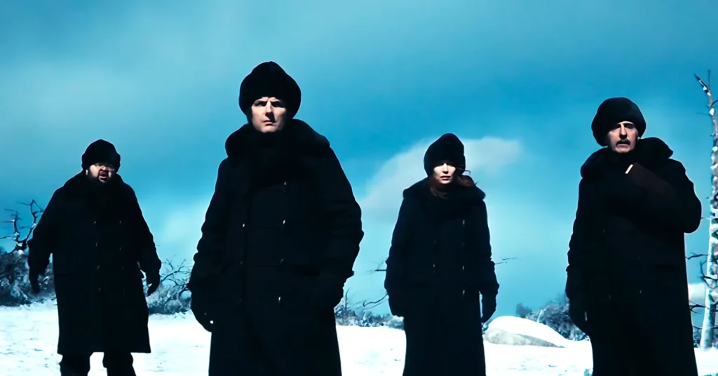 Lumon innies walking in formation at the ORTBO event, in a snowy landscape during episode 2x04 of Severance.