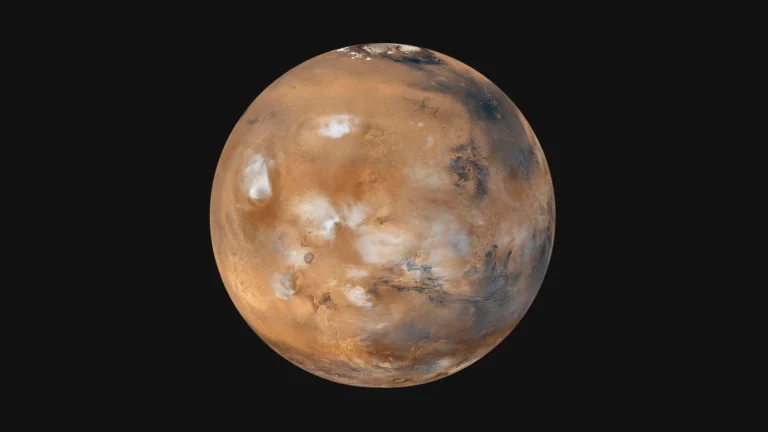 Image of planet Mars captured by a space probe, highlighting its reddish surface, polar ice caps, and volcanic formations such as Olympus Mons. The image contributes to the understanding of Martian geology and climate.