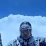 Peng Yujiang covered in ice during an extreme flight in China, reportedly caused by a Cloud Suck event. Parts of the footage were identified as AI-generated.