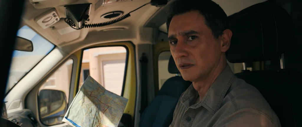 Manousos Oviedo arrives at Carol’s house in Pluribus, marking the alliance of two immune individuals amid the expansion of the collective mind.